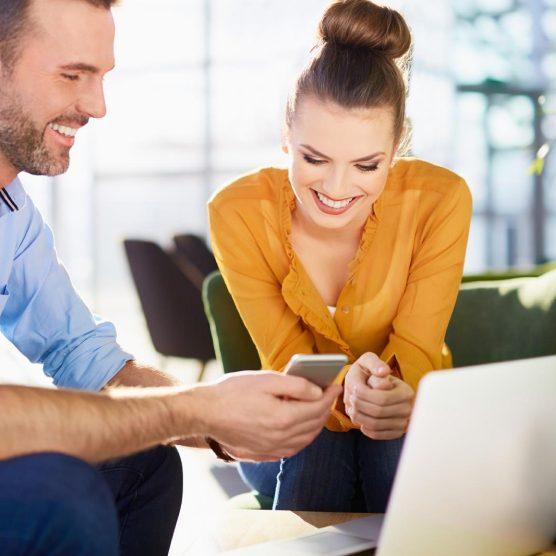 Two people looking at reviews